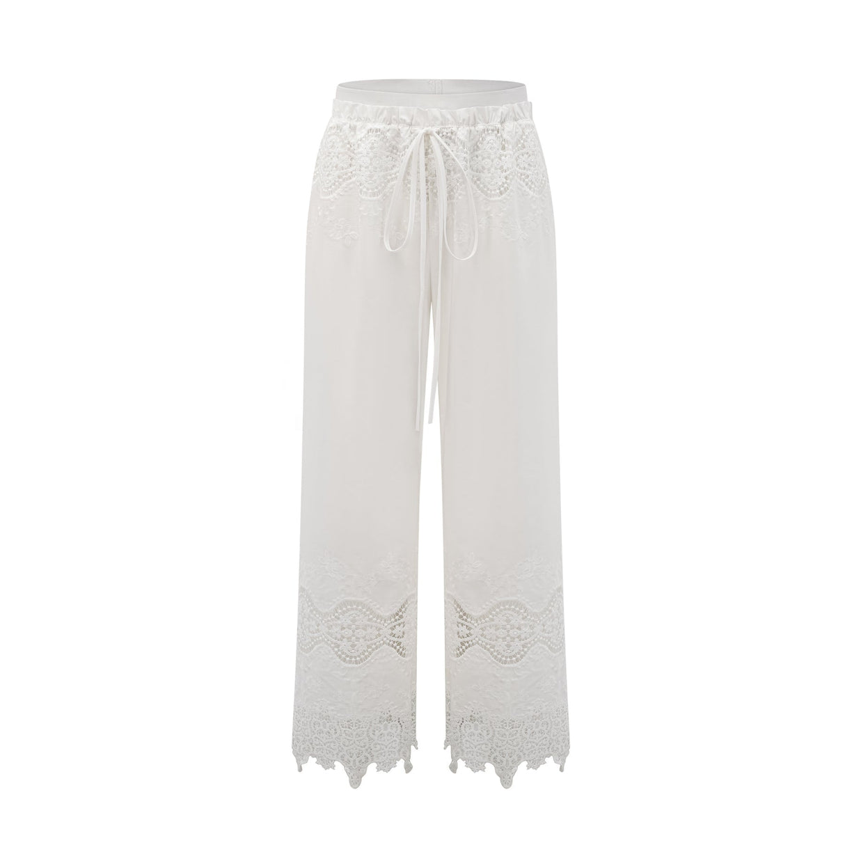 A model wearing a matching set consisting of a cropped top and trousers in white The top features lace trim and cutout details The trousers are high waisted and flared The set has a romantic and feminine style