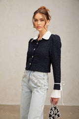 A navy blue tweed jacket with panelled design called Doriane