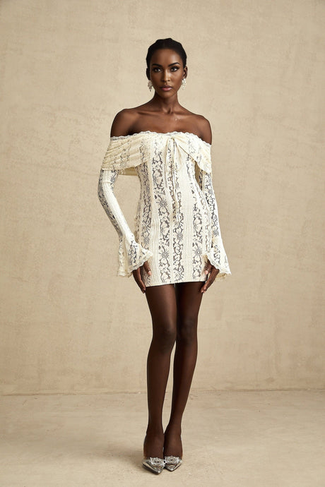 A neutral colored mini dress with floral lace pattern and flared cuffs named Émeline
