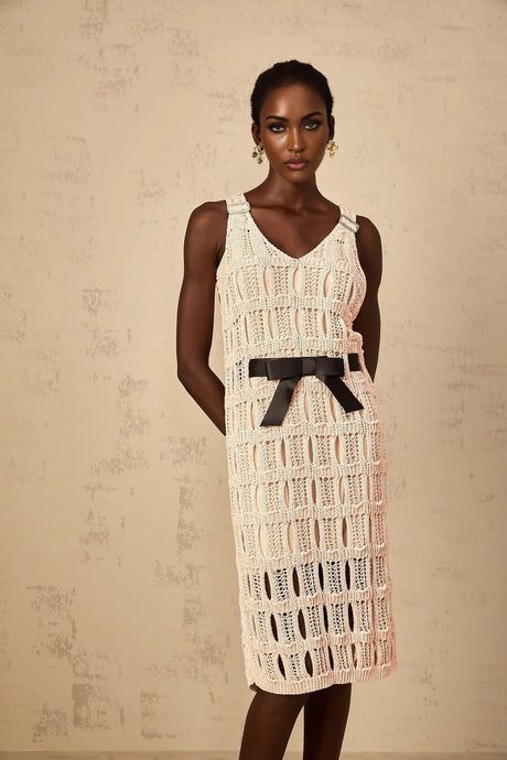 A pink midi dress with a crochet knit pattern featuring a bowknot detail named Elodie