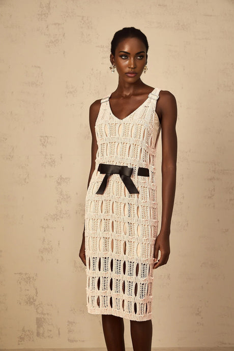 A pink midi dress with a crochet knit pattern featuring a bowknot detail named Elodie
