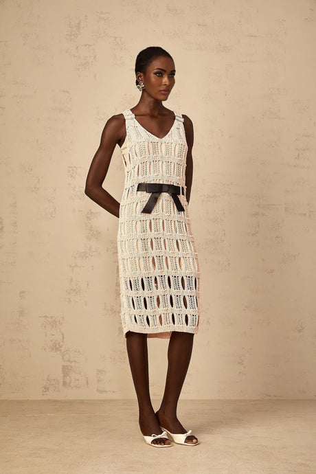 A pink midi dress with a crochet knit pattern featuring a decorative bowknot detail