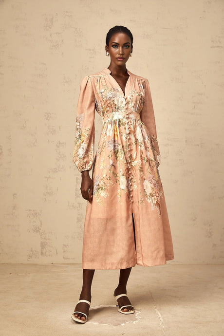 A pink midi dress with a floral print pattern and Vneck design called Sidonie