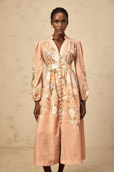 A pink midi dress with a floral print pattern and Vneck design called Sidonie