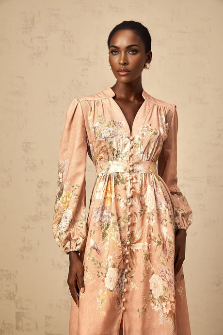A pink midi dress with a floral print pattern and Vneck design named Sidonie