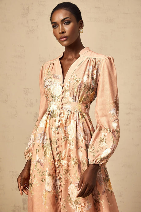 A pink midi dress with a floral print pattern and Vneckline called Sidonie
