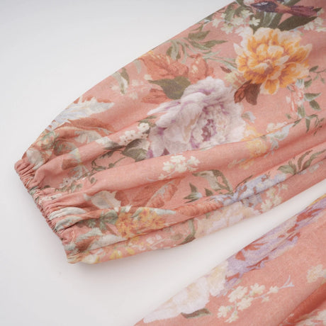 A pink midi dress with a Vneck and floral print pattern called Sidonie