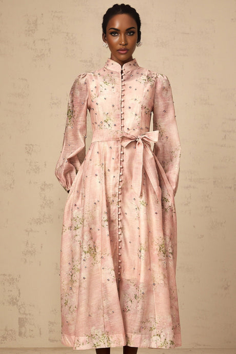 A pink midi dress with floral print and embellishments featuring a Narcisse design