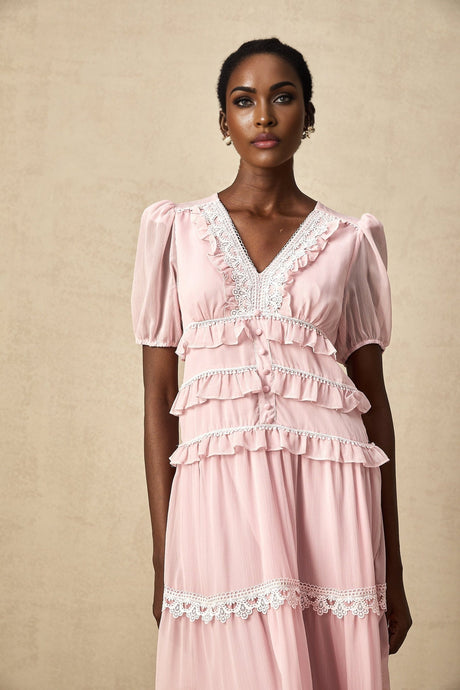 A pink midi dress with ruffled tiers and a feminine Amelie style design