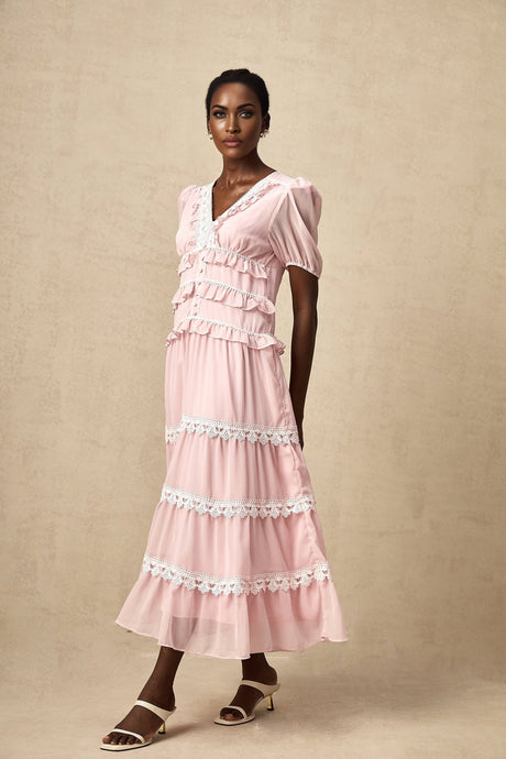 A pink midi dress with ruffled tiers and a feminine Amelie style