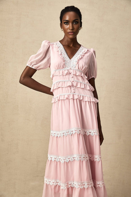 A pink midi dress with ruffled tiers and a feminine design named Amelie