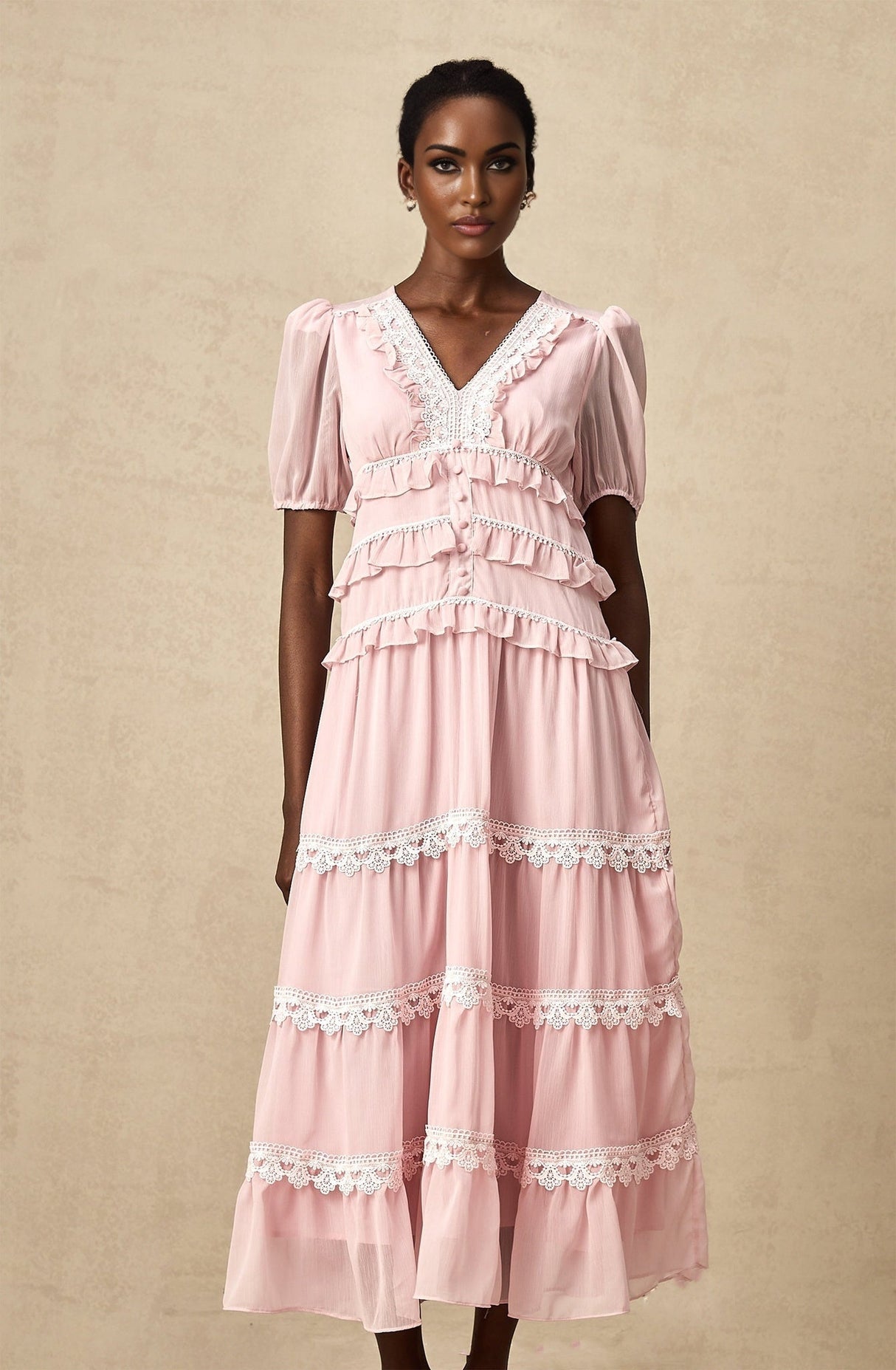 A pink midi dress with ruffled tiers and a feminine silhouette named Amelie
