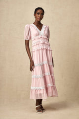 A pink midi dress with ruffled tiers and a feminine silhouette named Amelie