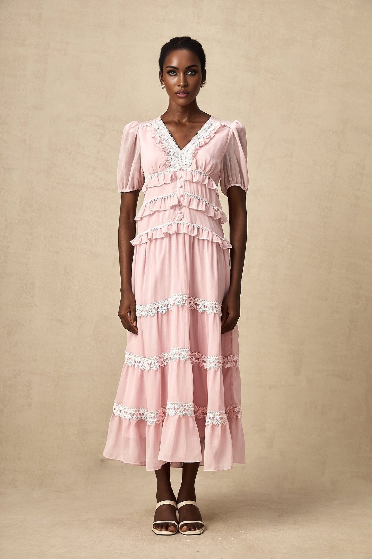 A pink midi dress with ruffled tiers and a feminine silhouette named Amelie