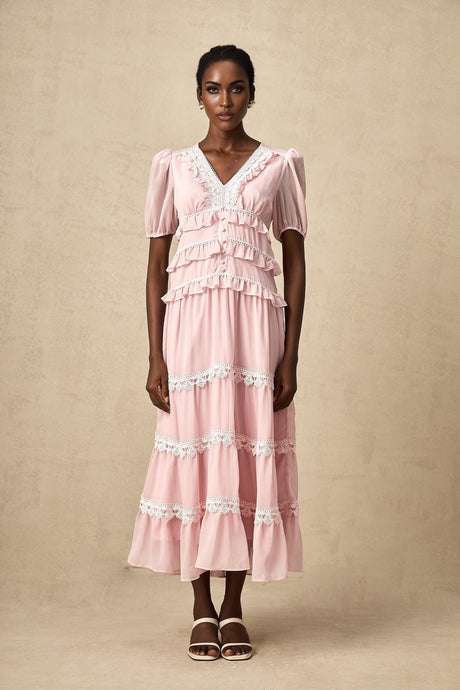 A pink midi dress with ruffled tiers and a feminine silhouette named Amelie