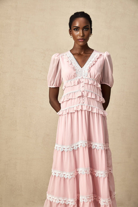 A pink midi dress with ruffled tiers and a feminine silhouette named Amelie
