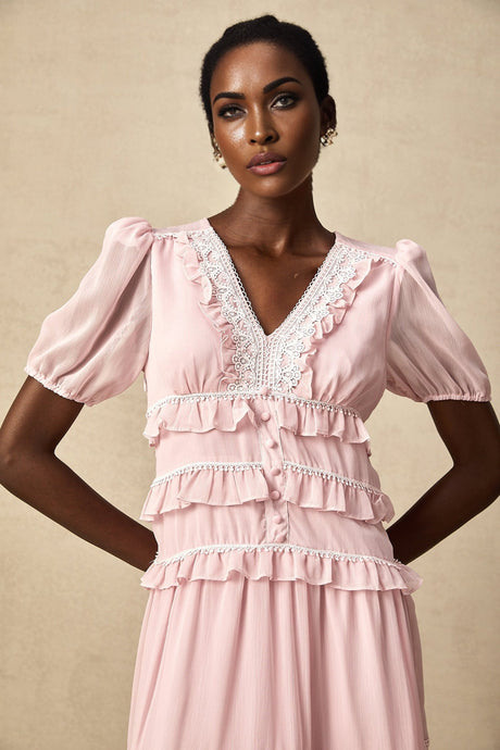 A pink midi dress with ruffled tiers and a feminine silhouette named Amelie