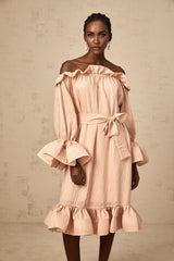 A pink midi dress with ruffles and a tied waist detail named Agathe