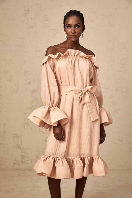 A pink midi dress with ruffles and a tied waist detail named Agathe