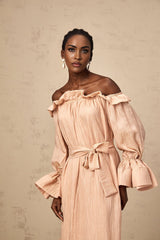 A pink midi dress with ruffles and a tied waist named Agathe