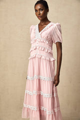 A pink midi dress with tiered ruffles and a feminine Amelie style