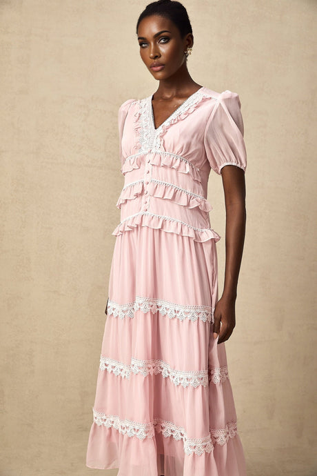 A pink midi dress with tiered ruffles and a feminine Amelie style