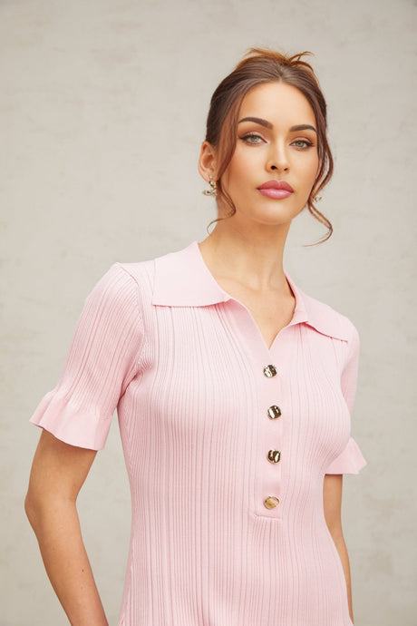 A pink mini dress with a flared skirt and fine knit fabric featuring long sleeves and a fitted bodice