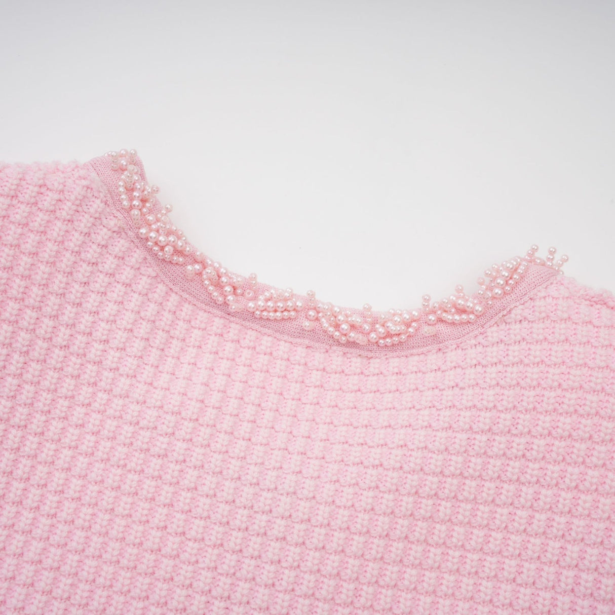 A pink mini dress with a knit texture and beaded embellishments named Eugenie