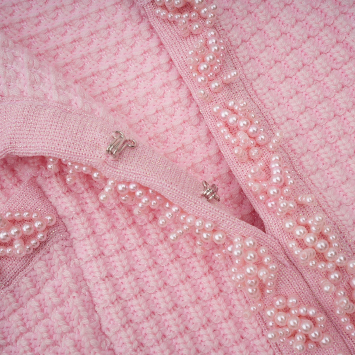A pink mini dress with a knit texture featuring beaded embellishments named Eugenie