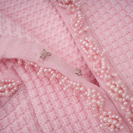 A pink mini dress with a knit texture featuring beaded embellishments named Eugenie
