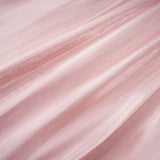 A pink mini dress with a pleated skirt and embellished details named Helena