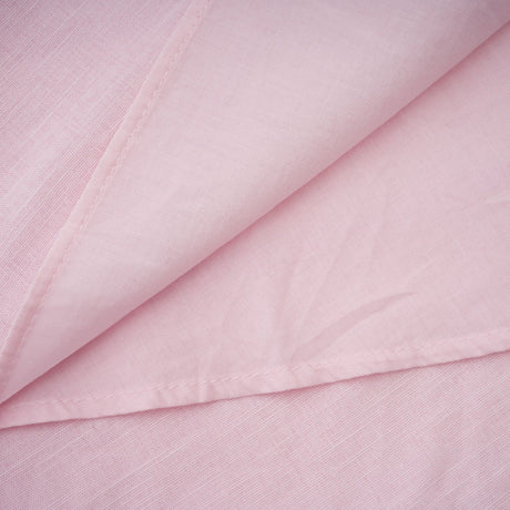 A pink mini dress with an offshoulder neckline featuring threedimensional petal details and a Juliette style design
