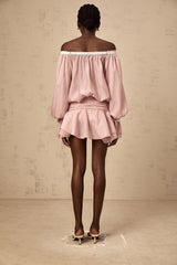 A pink offshoulder mini dress with a bow detail and flounced design featuring a fitted bodice and short ruffled skirt
