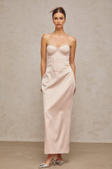 A pink satin maxi dress with an offshoulder corset style bodice named Elodie