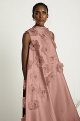 A pink sleeveless midi dress with floral applique details named Emilie