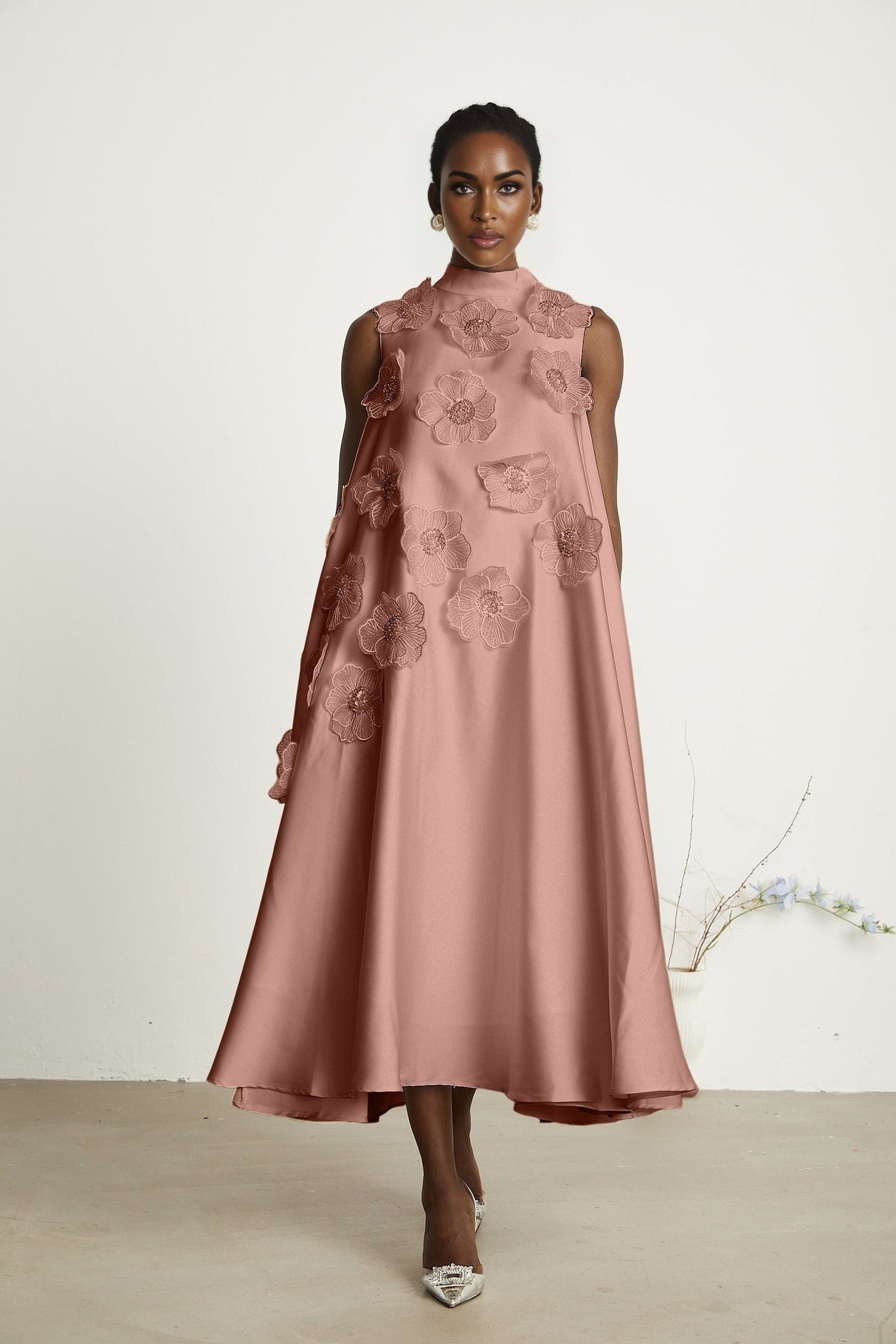A pink sleeveless midi dress with floral applique details named Emilie