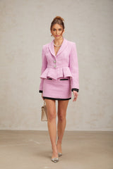 A pink tweed matching set consisting of a top and skirt in a feminine style named Amanda