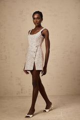 A pink tweed mini dress with embellishments named Aoife featuring a short hemline and textured fabric