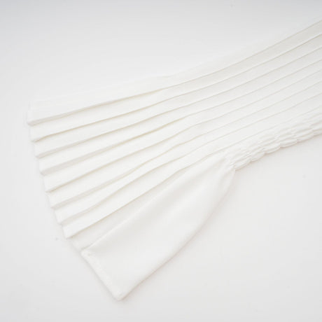 A plisse pleated mini dress with a V neckline in a light color likely featuring short sleeves and a fitted silhouette named Claudette