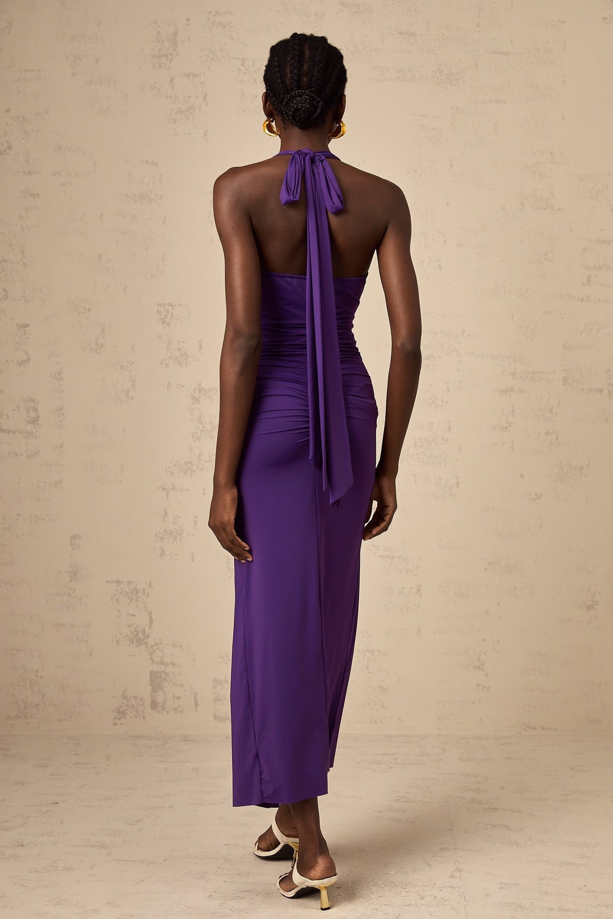 A purple halterneck midi dress with ruched detailing named Renata