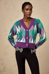 A purple knit top with an argyle pattern featuring a classic design and soft texture