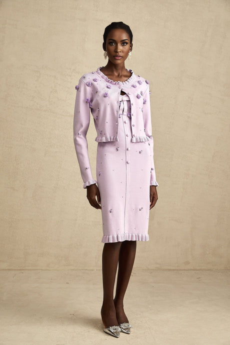 A purple knitted cardigan and dress set with faux flower embellishments featuring matching Estelle design