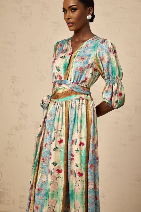 A red floral print wrap dress with a midi length skirt and short sleeves