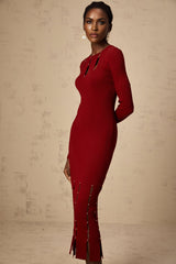 A red knit midi dress with long sleeves and beaded details featuring a cutout design and a form fitting silhouette