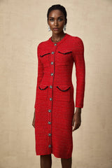 A red knitted midi dress with embellishments named Faustine featuring a fitted silhouette and decorative details throughout the fabric