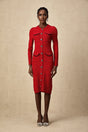 A red knitted midi dress with embellishments named Faustine featuring a fitted silhouette and decorative details throughout the fabric