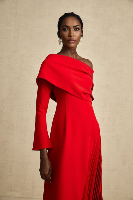 A red maxi dress with a high slit and pleated design perfect for Valentines Day occasions