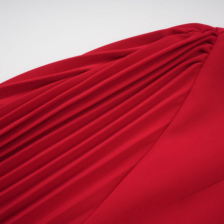 A red maxi dress with a high slit and pleated design suitable for Valentines Day celebrations