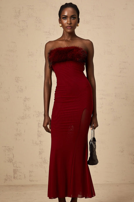 A red midi dress with faux fur trim and offshoulder mesh sleeves