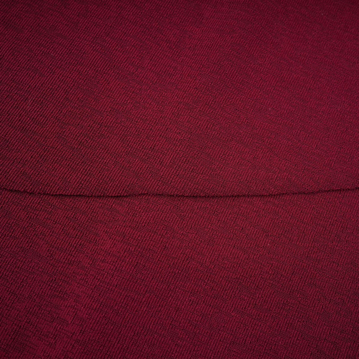 A red midi dress with ruched detailing and a flap design named Camille